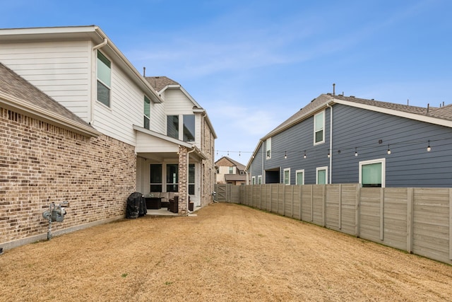 view of yard featuring a patio area and a fenced backyard