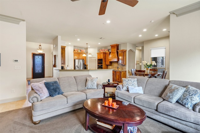 living room featuring recessed lighting, baseboards, arched walkways, a ceiling fan, and light tile patterned flooring