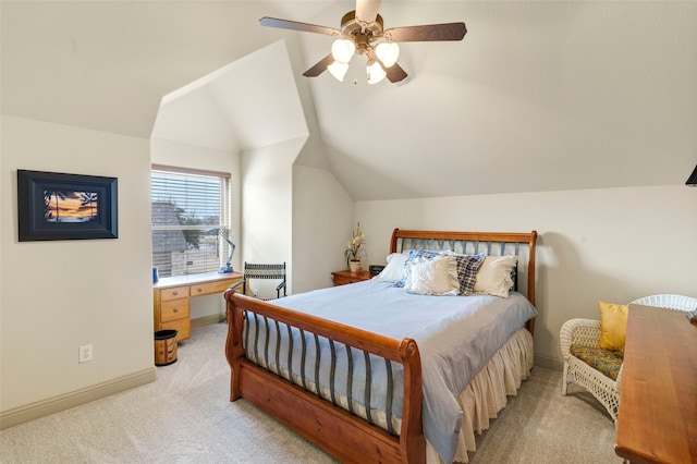 bedroom featuring lofted ceiling, baseboards, a ceiling fan, and light colored carpet