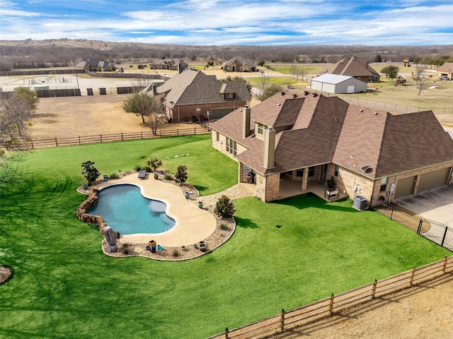 view of swimming pool with a fenced in pool, a yard, central air condition unit, a patio area, and a fenced backyard