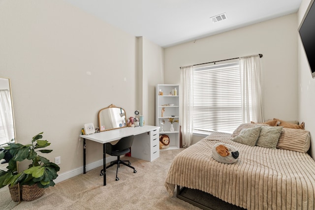 bedroom featuring light colored carpet, visible vents, and baseboards