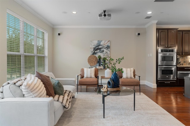 living area featuring dark wood-style floors, crown molding, recessed lighting, visible vents, and baseboards