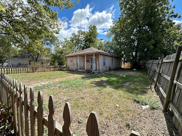 view of yard with a fenced backyard