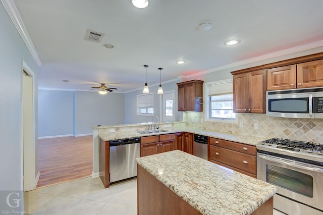 kitchen featuring stainless steel appliances, visible vents, ornamental molding, and a peninsula