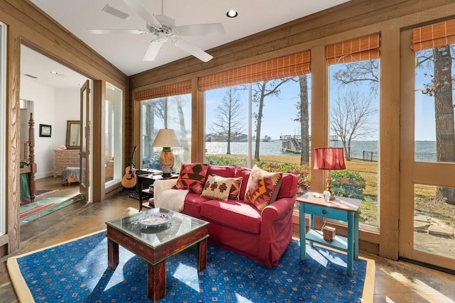 sunroom with visible vents and a ceiling fan