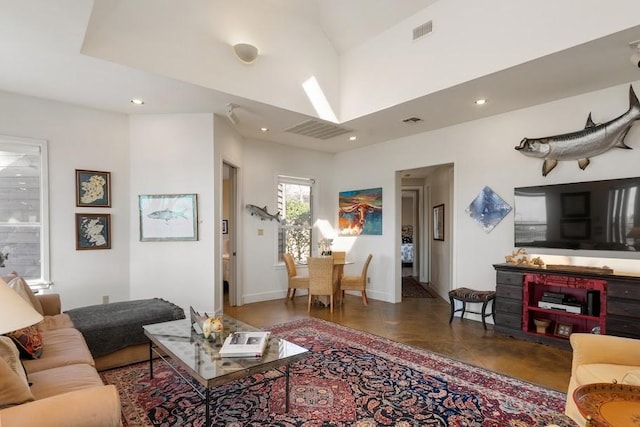 living area featuring recessed lighting, visible vents, and baseboards