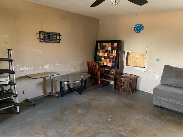 interior space featuring concrete flooring and ceiling fan