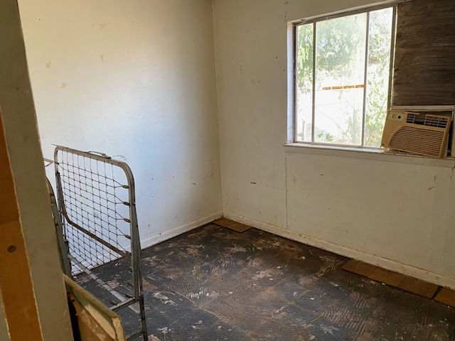 unfurnished room with cooling unit