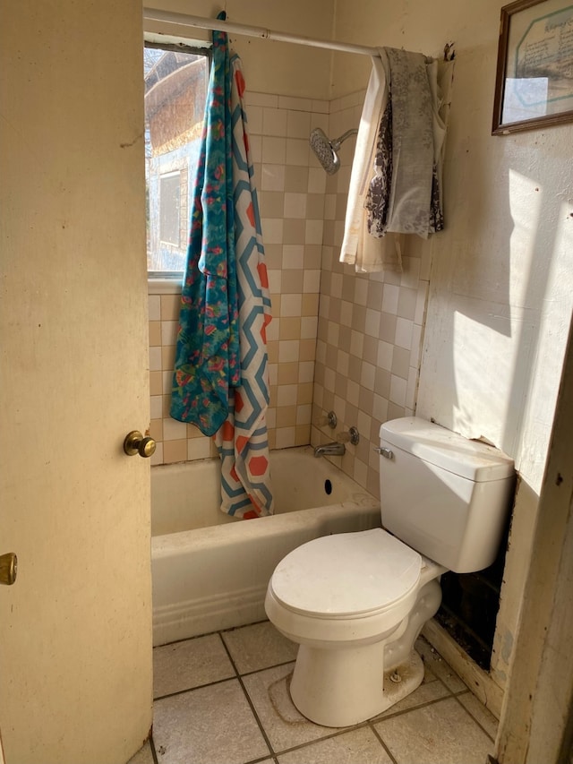 full bathroom featuring toilet, shower / tub combo, and tile patterned floors