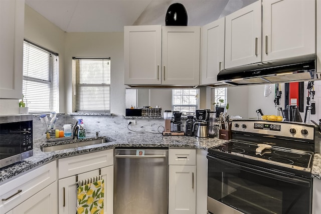 kitchen featuring stainless steel appliances, a sink, white cabinetry, and under cabinet range hood