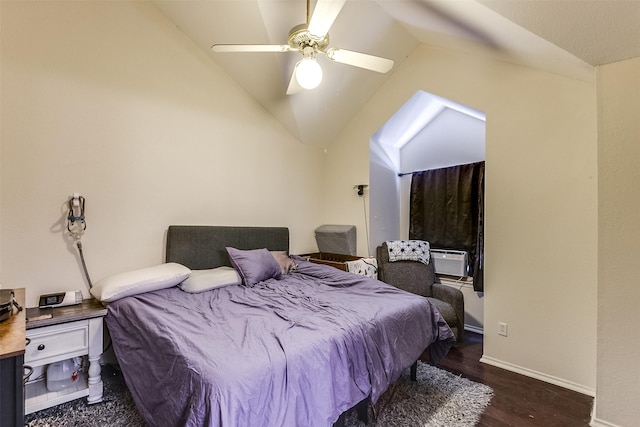 bedroom featuring a ceiling fan, vaulted ceiling, baseboards, and wood finished floors