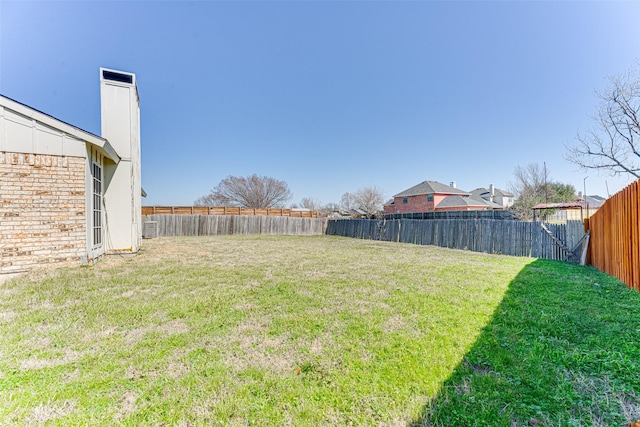 view of yard featuring a fenced backyard