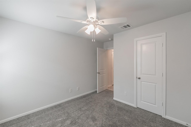 unfurnished bedroom with ceiling fan, carpet flooring, visible vents, and baseboards