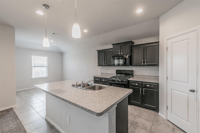 kitchen featuring black appliances, light countertops, a sink, and visible vents