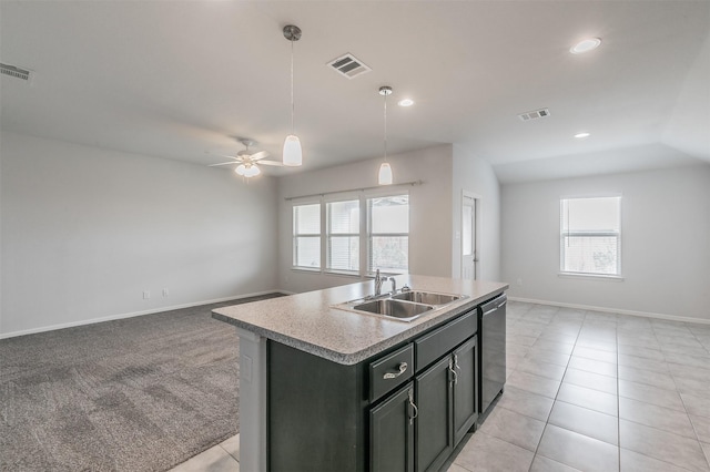 kitchen with dishwasher, visible vents, open floor plan, and a sink