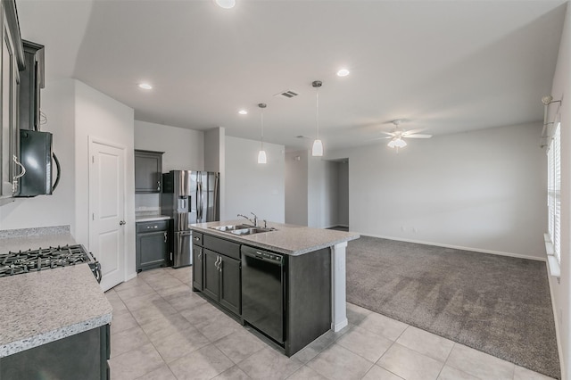 kitchen with a sink, visible vents, light countertops, black appliances, and decorative light fixtures