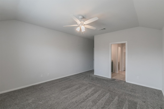 unfurnished bedroom featuring lofted ceiling, carpet, baseboards, and visible vents