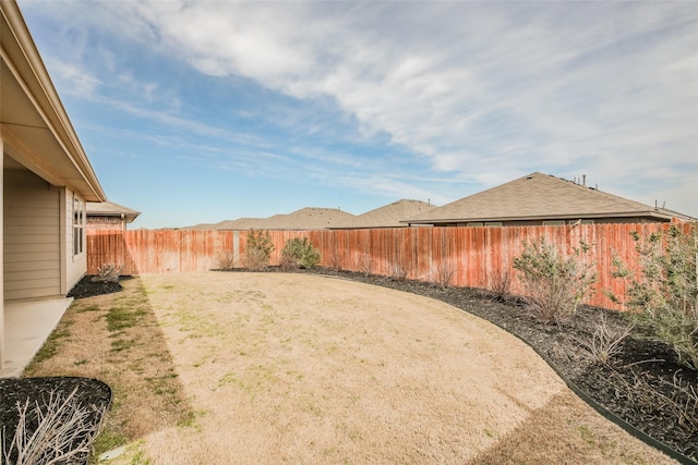 view of yard with a fenced backyard