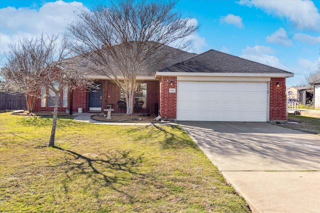 single story home featuring brick siding, a shingled roof, a garage, driveway, and a front lawn