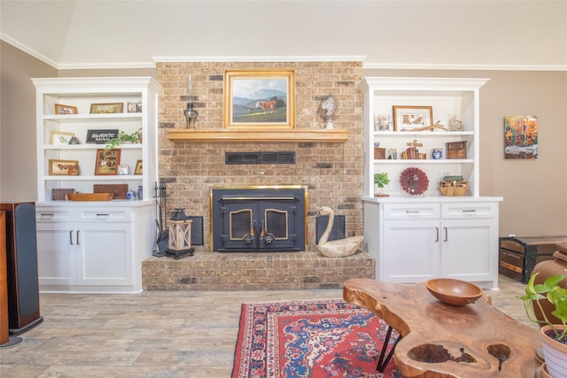 living area with light wood-style floors and ornamental molding