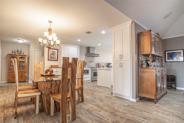 dining room featuring light wood finished floors, recessed lighting, visible vents, an inviting chandelier, and baseboards