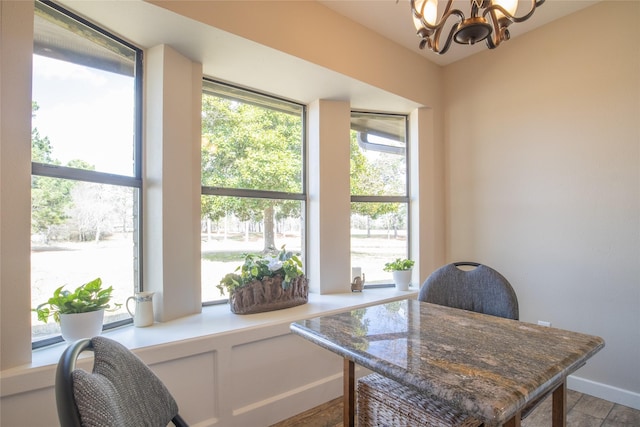 office space featuring an inviting chandelier and a wealth of natural light