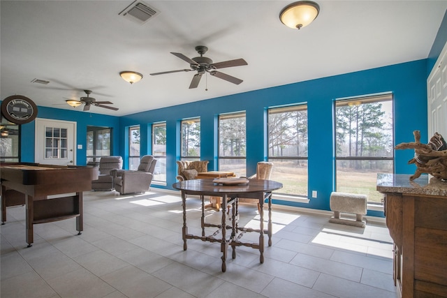 dining area featuring plenty of natural light, visible vents, and a ceiling fan