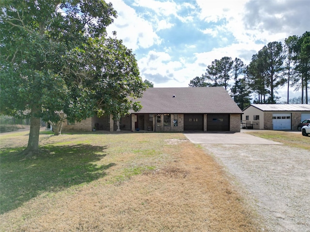 view of front facade with an attached garage, brick siding, driveway, roof with shingles, and a front yard