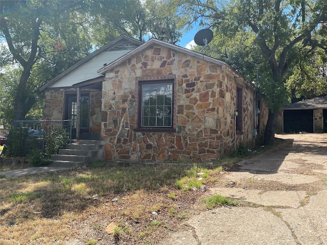 view of property exterior featuring stone siding