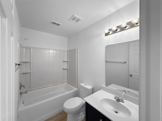 bathroom featuring visible vents, vanity, toilet, and shower / bathtub combination