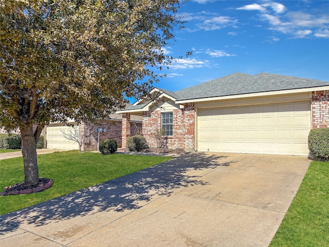 single story home featuring driveway, roof with shingles, an attached garage, a front lawn, and brick siding