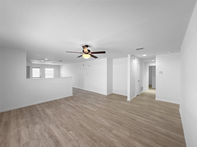 unfurnished room featuring recessed lighting, a ceiling fan, baseboards, visible vents, and light wood-style floors