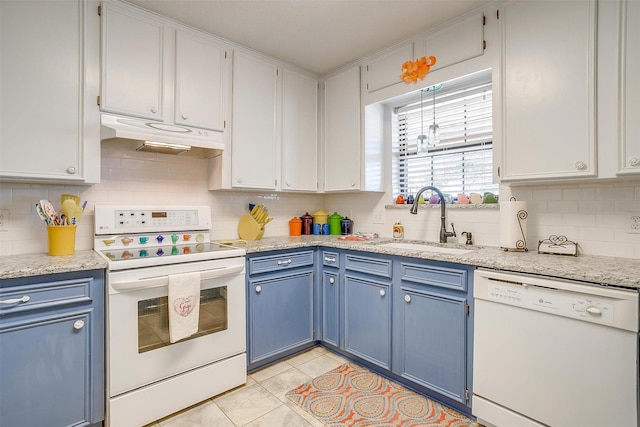 kitchen featuring blue cabinets, white appliances, under cabinet range hood, and a sink