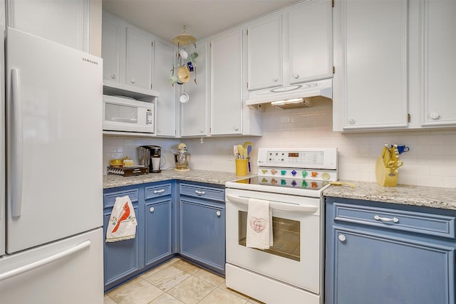 kitchen with under cabinet range hood, blue cabinets, white appliances, white cabinets, and decorative backsplash