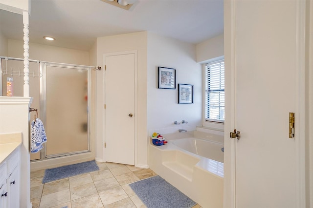 bathroom with a stall shower, vanity, a bath, and tile patterned floors