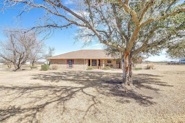 ranch-style house with brick siding