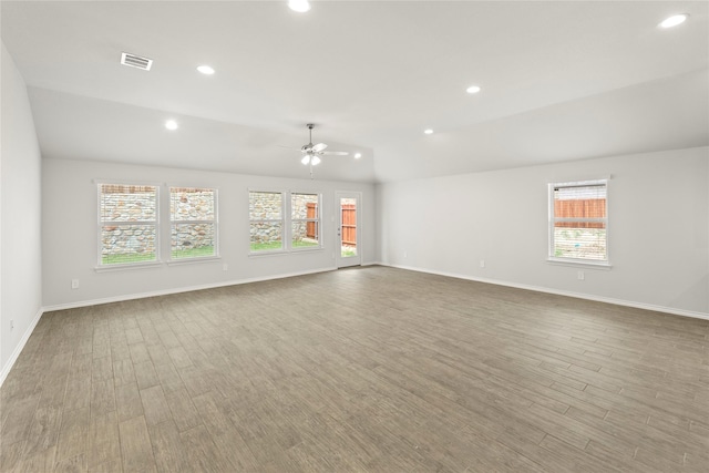 1825 Osage Trl, Mesquite, TX 75149 - empty room with plenty of natural light, a ceiling fan, recessed lighting, wood finished floors, and baseboards