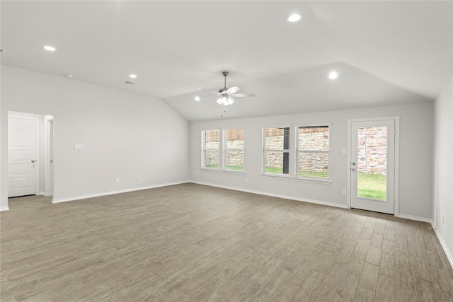 1825 Osage Trl, Mesquite, TX 75149 - spare room featuring a ceiling fan, recessed lighting, vaulted ceiling, light wood-style flooring, and baseboards