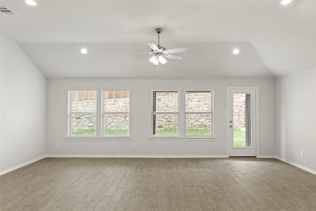 1825 Osage Trl, Mesquite, TX 75149 - spare room with lofted ceiling, plenty of natural light, recessed lighting, a ceiling fan, and wood finished floors