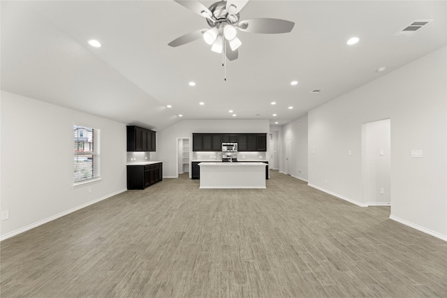 1825 Osage Trl, Mesquite, TX 75149 - unfurnished living room with recessed lighting, a ceiling fan, light wood-style flooring, baseboards, and lofted ceiling