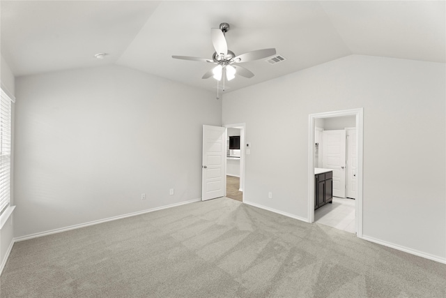 1825 Osage Trl, Mesquite, TX 75149 - unfurnished bedroom with vaulted ceiling, light colored carpet, ensuite bathroom, a walk in closet, and baseboards