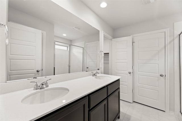 1825 Osage Trl, Mesquite, TX 75149 - full bath with a stall shower, double vanity, tile patterned flooring, and recessed lighting