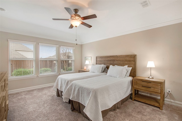 bedroom with carpet floors, visible vents, ornamental molding, and baseboards