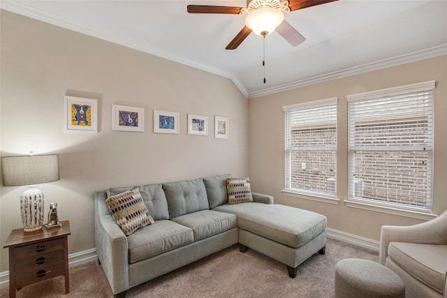 carpeted living area featuring lofted ceiling, ceiling fan, ornamental molding, and baseboards