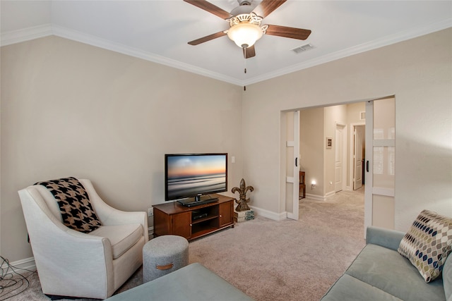 living room featuring ornamental molding, visible vents, light carpet, and baseboards