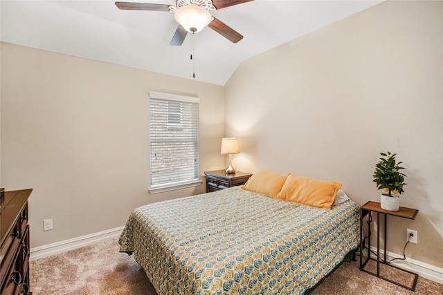 carpeted bedroom featuring lofted ceiling, ceiling fan, and baseboards