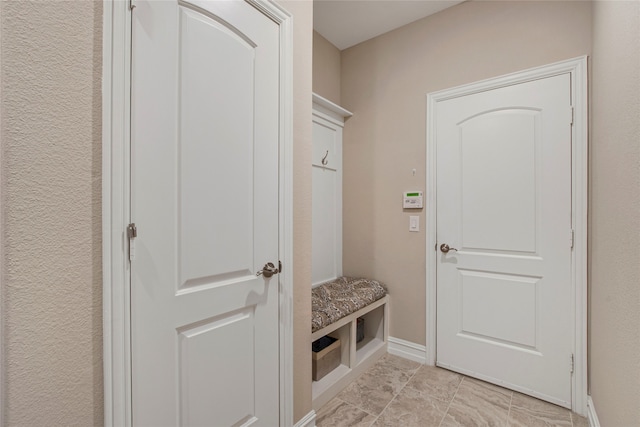 mudroom featuring baseboards