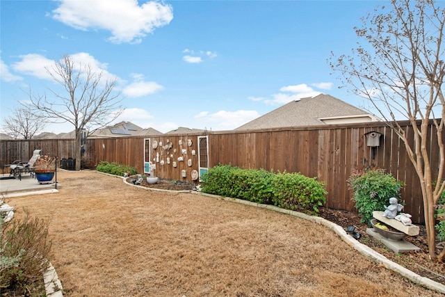 view of yard with a patio and a fenced backyard