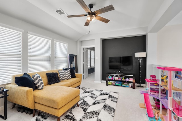 living room featuring carpet, visible vents, vaulted ceiling, ceiling fan, and baseboards