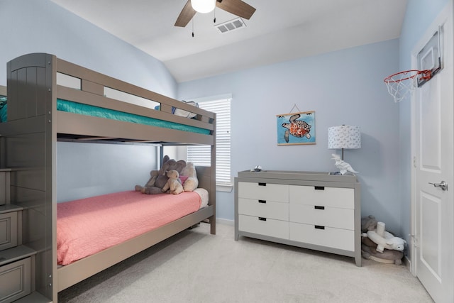 bedroom featuring baseboards, visible vents, a ceiling fan, light colored carpet, and lofted ceiling